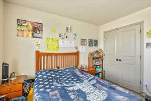 Bedroom featuring a textured ceiling