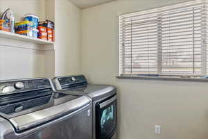 Washroom featuring washing machine and clothes dryer