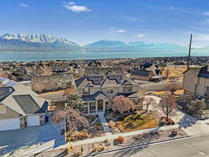 Birds eye view of property featuring a water and mountain view