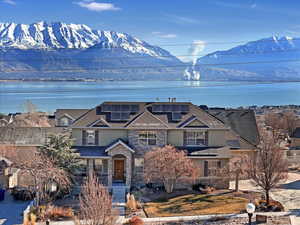 Property view of mountains with a water view