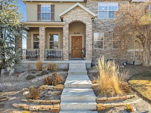 Property entrance featuring covered porch