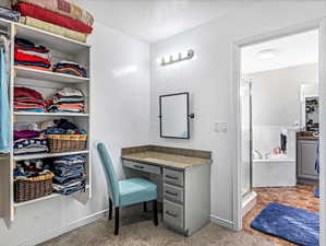 Bathroom featuring tile patterned floors, independent shower and bath, and a textured ceiling