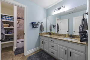 Bathroom with vanity and shower / tub combination