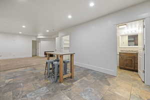 Kitchen featuring sink and a breakfast bar