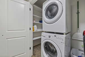 Clothes washing area with stacked washer and clothes dryer