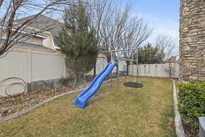 View of play area featuring a lawn