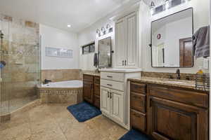 Bathroom with vanity and plus walk in shower