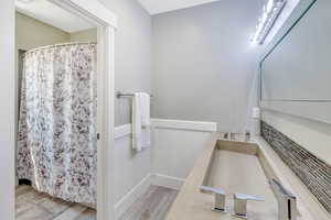 Bathroom with vanity and hardwood / wood-style floors