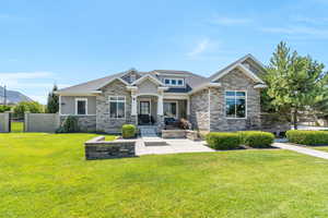 Craftsman-style house with a front lawn