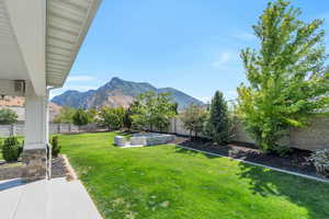 View of yard featuring a mountain view and a patio area