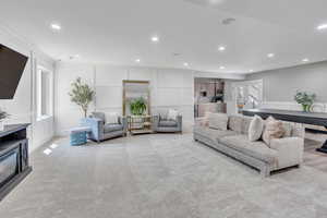 Carpeted living room featuring french doors