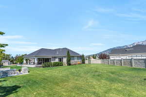 View of yard with a patio and a mountain view