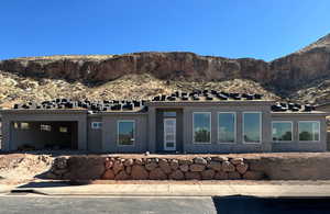 Exterior space featuring a mountain view and stucco siding