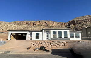 Back of house with a mountain view