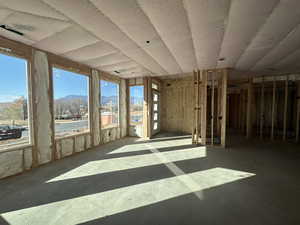 Unfurnished sunroom with a mountain view