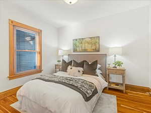 Bedroom with wood-type flooring