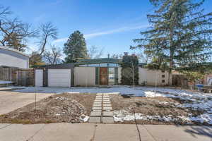 Ranch-style house featuring a garage