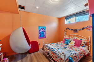 Bedroom with wood-type flooring