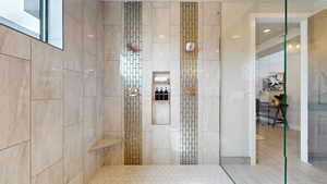 Bathroom with tiled shower