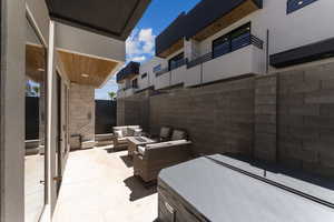 View of patio / terrace featuring an outdoor living space with a fire pit