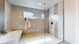 Bathroom with separate shower and tub and tile walls