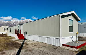 View of home's exterior with a mountain view