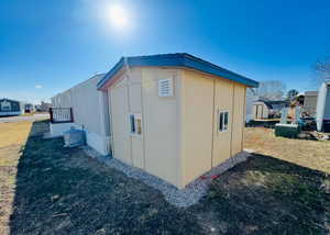 View of home's exterior featuring a yard