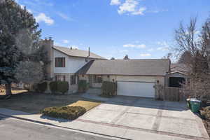 View of property with a garage