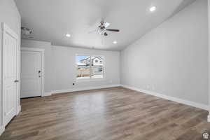Spare room featuring hardwood / wood-style floors and ceiling fan