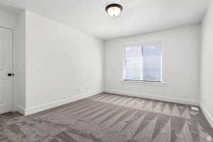 Unfurnished room featuring carpet