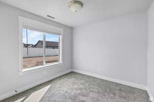 View of carpeted spare room