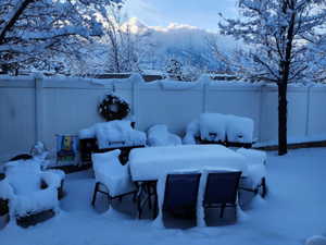 Snowy yard with a mountain view