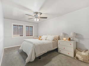 Bedroom with light carpet and ceiling fan