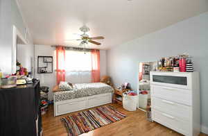 Bedroom featuring ceiling fan and light wood-type flooring