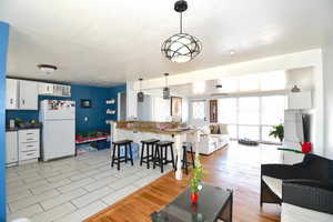 Living room with light hardwood / wood-style flooring