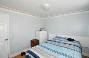 Bedroom featuring wood-type flooring