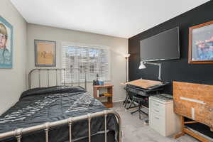 Bedroom with light colored carpet