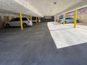 View of garage 1 covered and 1 uncovered parking spaces