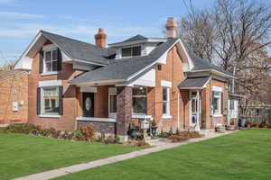 View of front of home featuring a front lawn