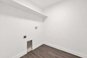 Clothes washing area featuring washer hookup, dark hardwood / wood-style flooring, and hookup for an electric dryer