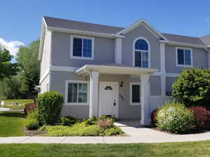 View of front of home featuring a front lawn