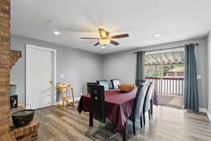 Dining area featuring baseboards, ceiling fan, recessed lighting, and wood finished floors