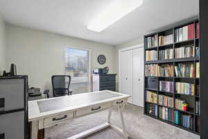 View of carpeted office/bedroom