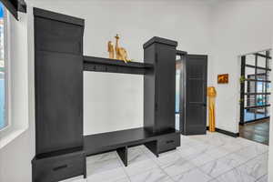 Mudroom with a high ceiling