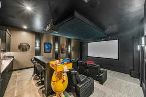 Cinema room with light tile patterned floors