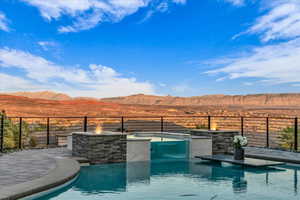 View of swimming pool with a mountain view