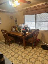 Dining room with crown molding and a chandelier