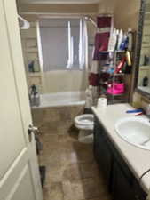 Full bathroom with vanity, toilet, and bathing tub / shower combination