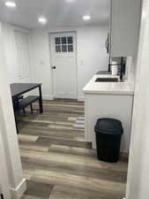 Interior space with dark wood-type flooring and sink