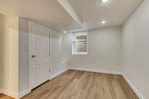 Spare room with light hardwood / wood-style floors